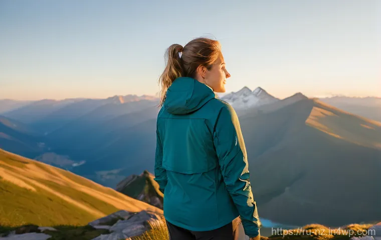 하이킹 중 멀미 예방 및 대처법 - Serene Mountain Vista with a Content Traveler**

A visually stunning, wide-angle cinematic photograp...